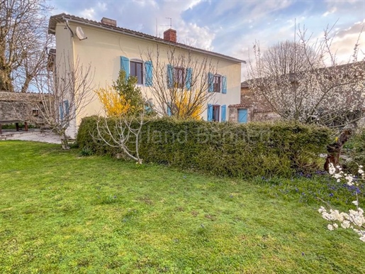 Stone Village property with a gite, outbuildings and garden.