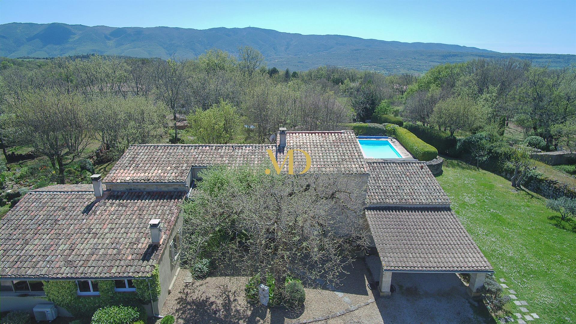 Charming stone property with Luberon view, swimming pool and outbuildings