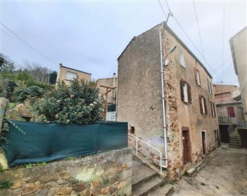 Stone village house with 70 m² of living space, studio of 25 m², terrace and small garden.