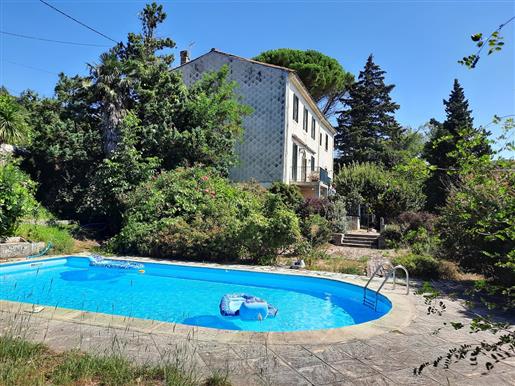 Character home with 202 m² of living space on 1448 m² with pool and private beach on the river.