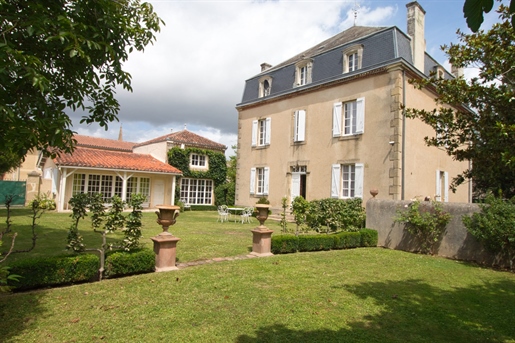 In the Gers, in Marciac, sumptuous manor house with outbuildings nestling in lovely garden.