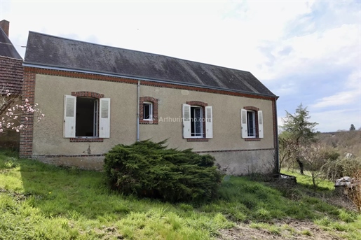 Farmhouse with outbuildings on almost two hectares of land.