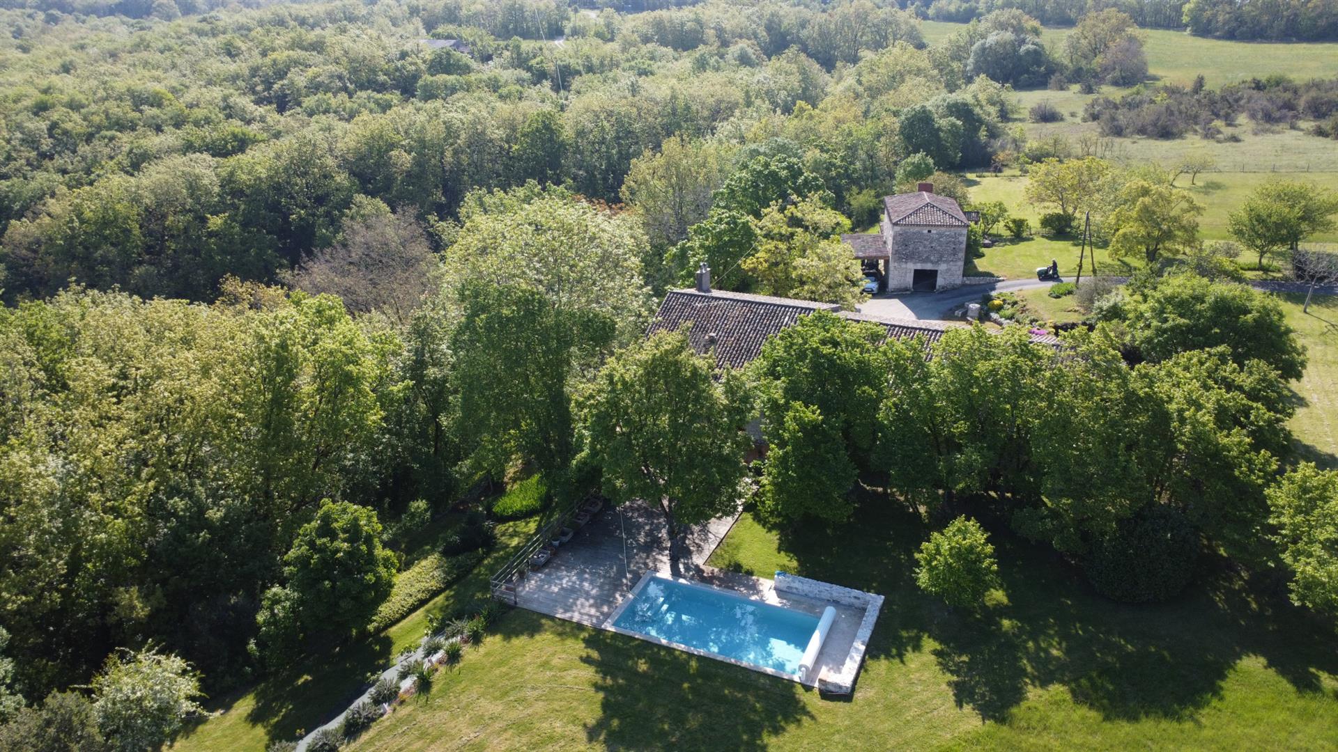 Stone house on approximately 2 hectares of land. 3 bedrooms, swimming pool. Stone outbuildings. A lo