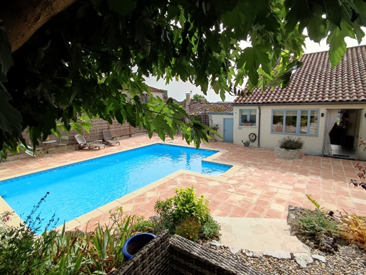 Village house with swimming pool and garden, three large bedrooms, garage and lots of authenticity