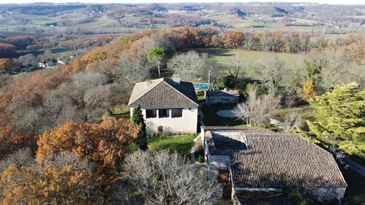 Magnificent fortified house with its stone outbuildings and a swimming pool on an exceptional 10 ha