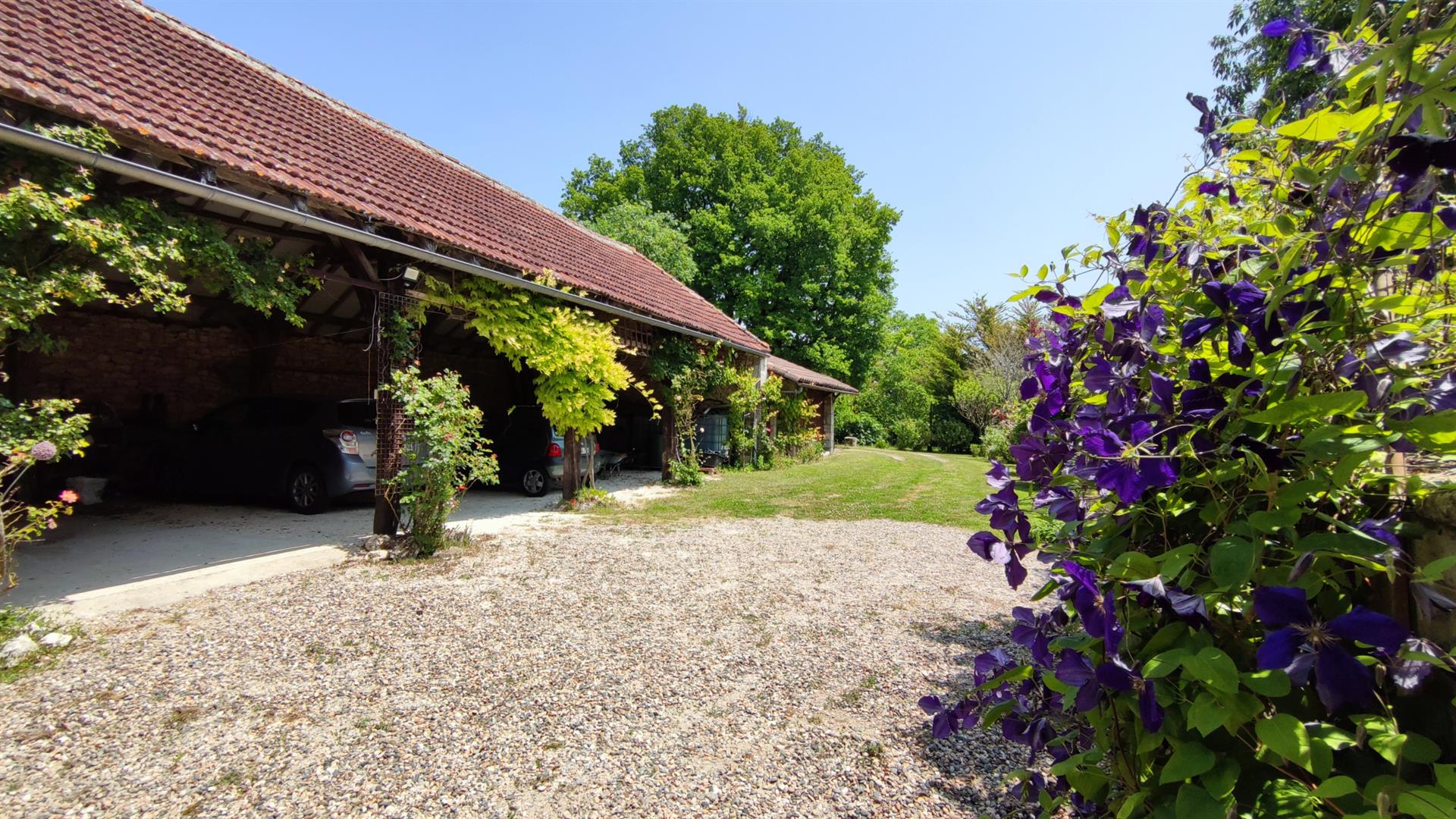 Charming stone property with outbuildings and large wooded grounds with open views