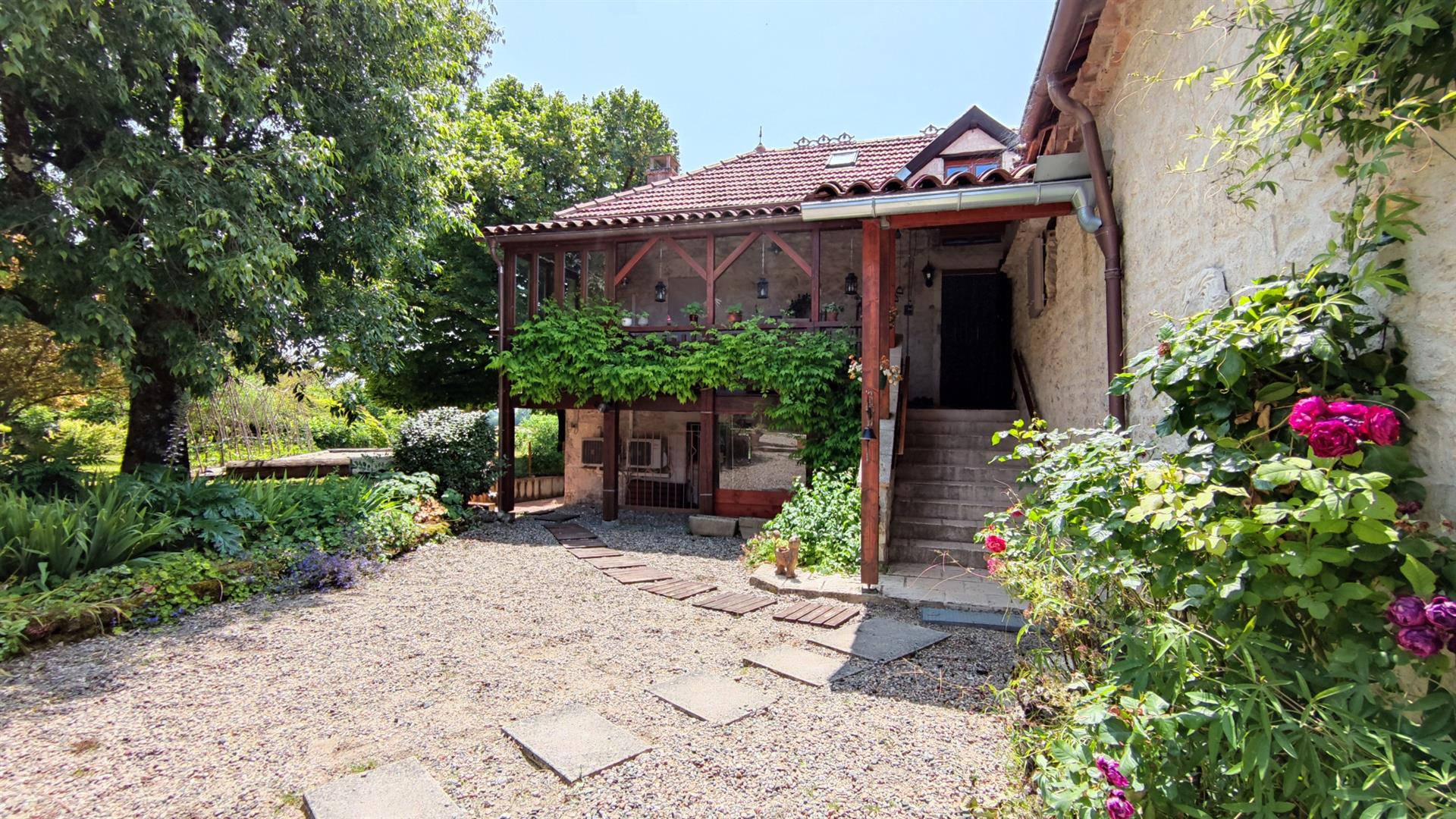 Charming stone property with outbuildings and large wooded grounds with open views