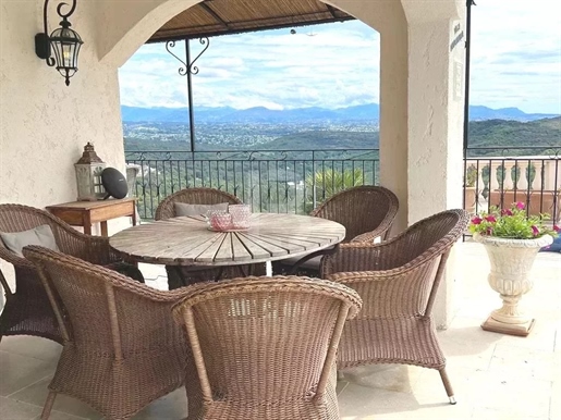 Luxurious villa for sale in Valbonne with breathtaking views of the sea and mountains.