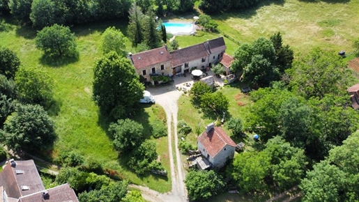 A pretty farmhouse, outbuildings and swimming pool