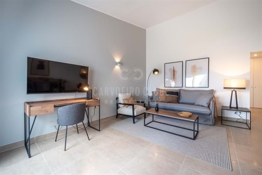 Fully renovated 1-bedroom first-floor apartment with communal pool