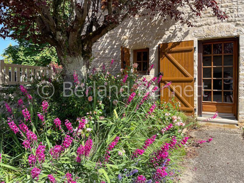Gorgeous stone house with outbuildings + land