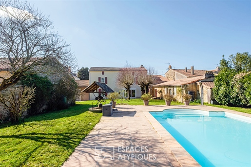 Charme van het oude herontdekt: familiehuis met zwembad en bijgebouwen