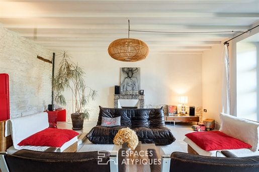 Casa con carácter entre concreto y piedra en el corazón del Marais