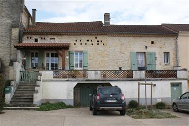 Village character house in good condition of 104 m² of living space with terrace, cellar and garage.