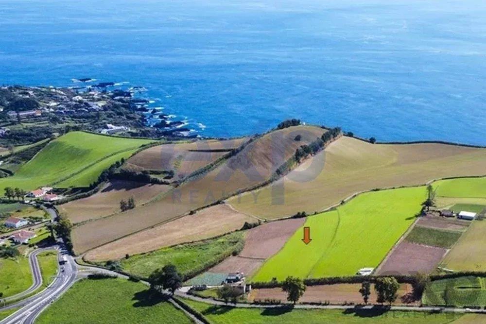 Land with Sea and Mountain Views