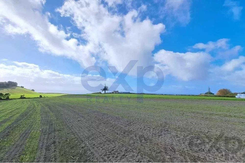 Land with Sea and Mountain Views
