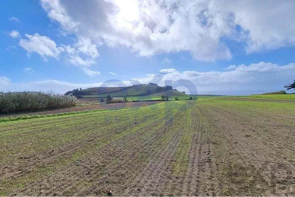 Land with Sea and Mountain Views