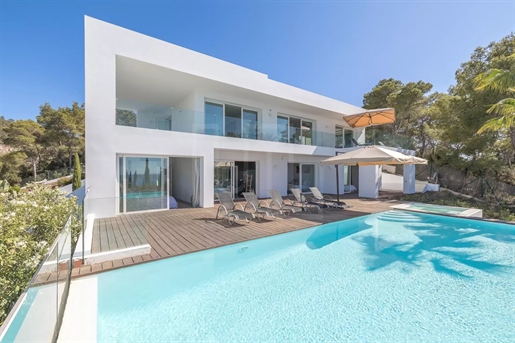 Modern property with sunset views overlooking the bay of Cala Moli.