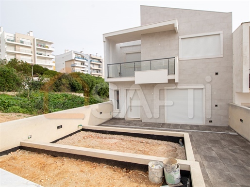 Two-Storey villa with basement and common green area with swimming pool and party area,