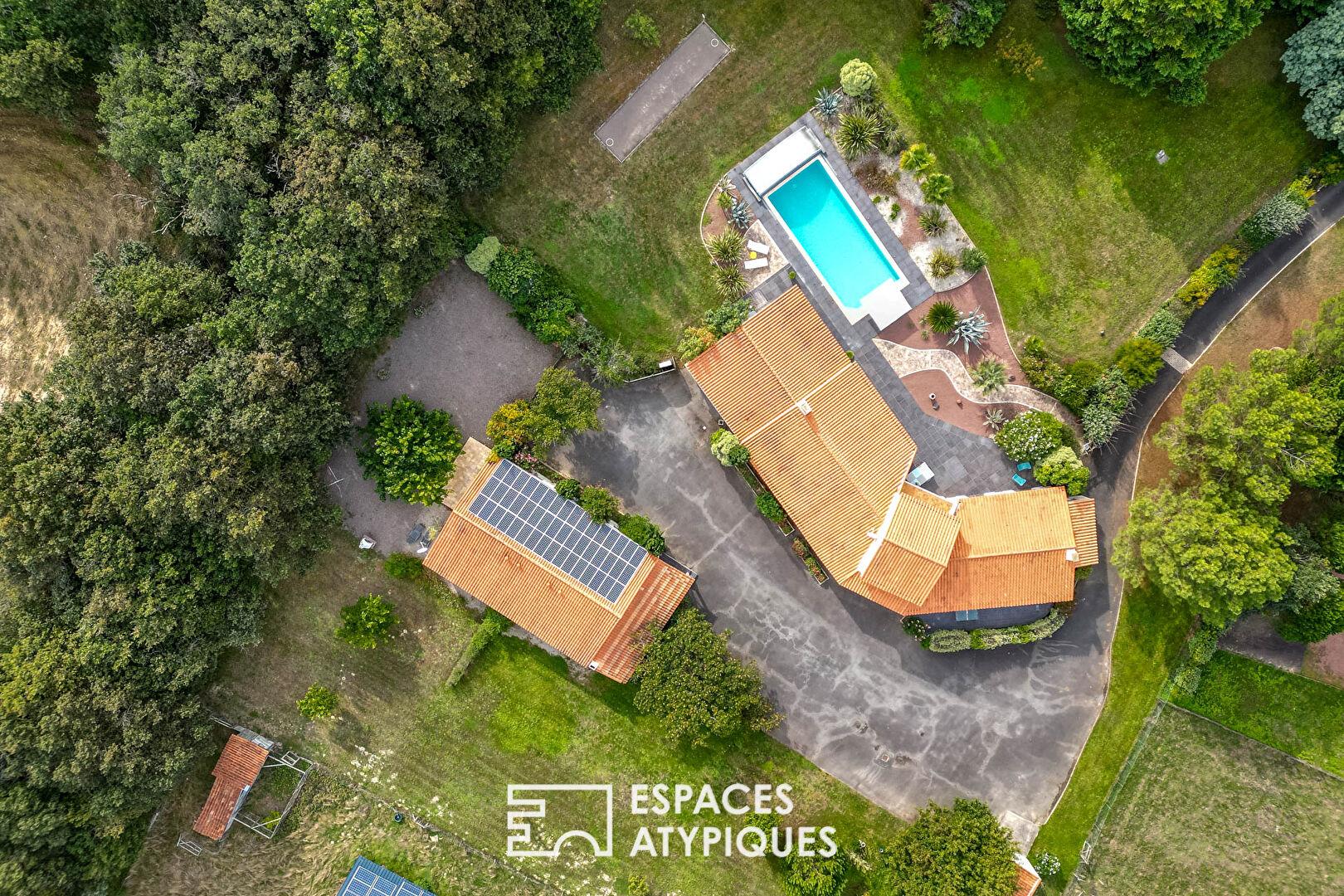 Large property with swimming pool in landscaped grounds