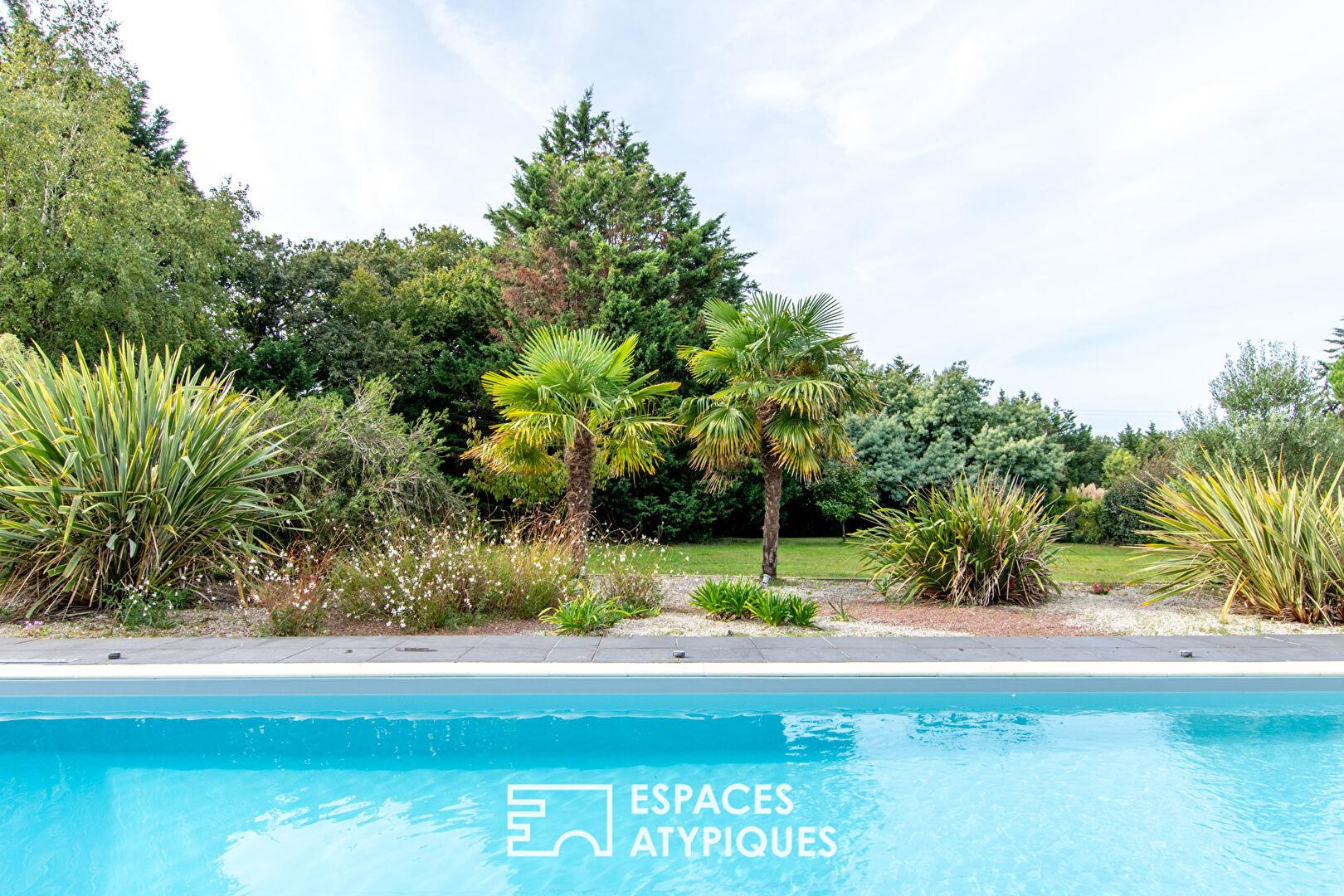 Large property with swimming pool in landscaped grounds
