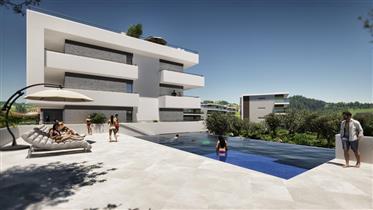 F4  neuf dans une copropriété privée avec piscine, jardin, salle de sport et garage à Portimão