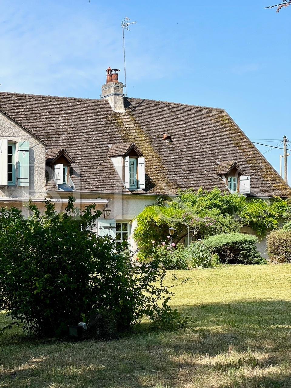 Large period house with character to renovate, park planted with trees, outbuildings.