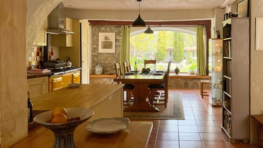 Stone cottage in sought after village, pool, gardens and workshops.