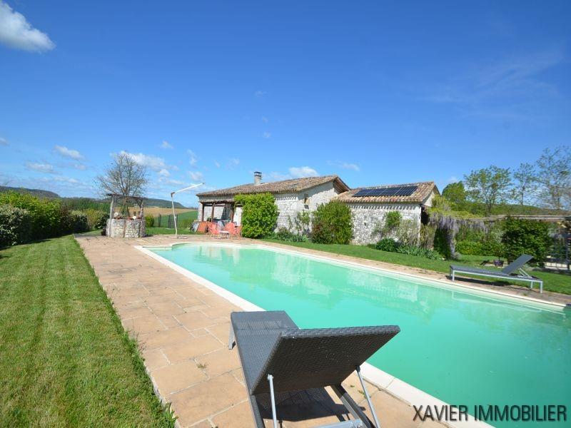 Property made up of two homes with a swimming pool, located in the countryside .