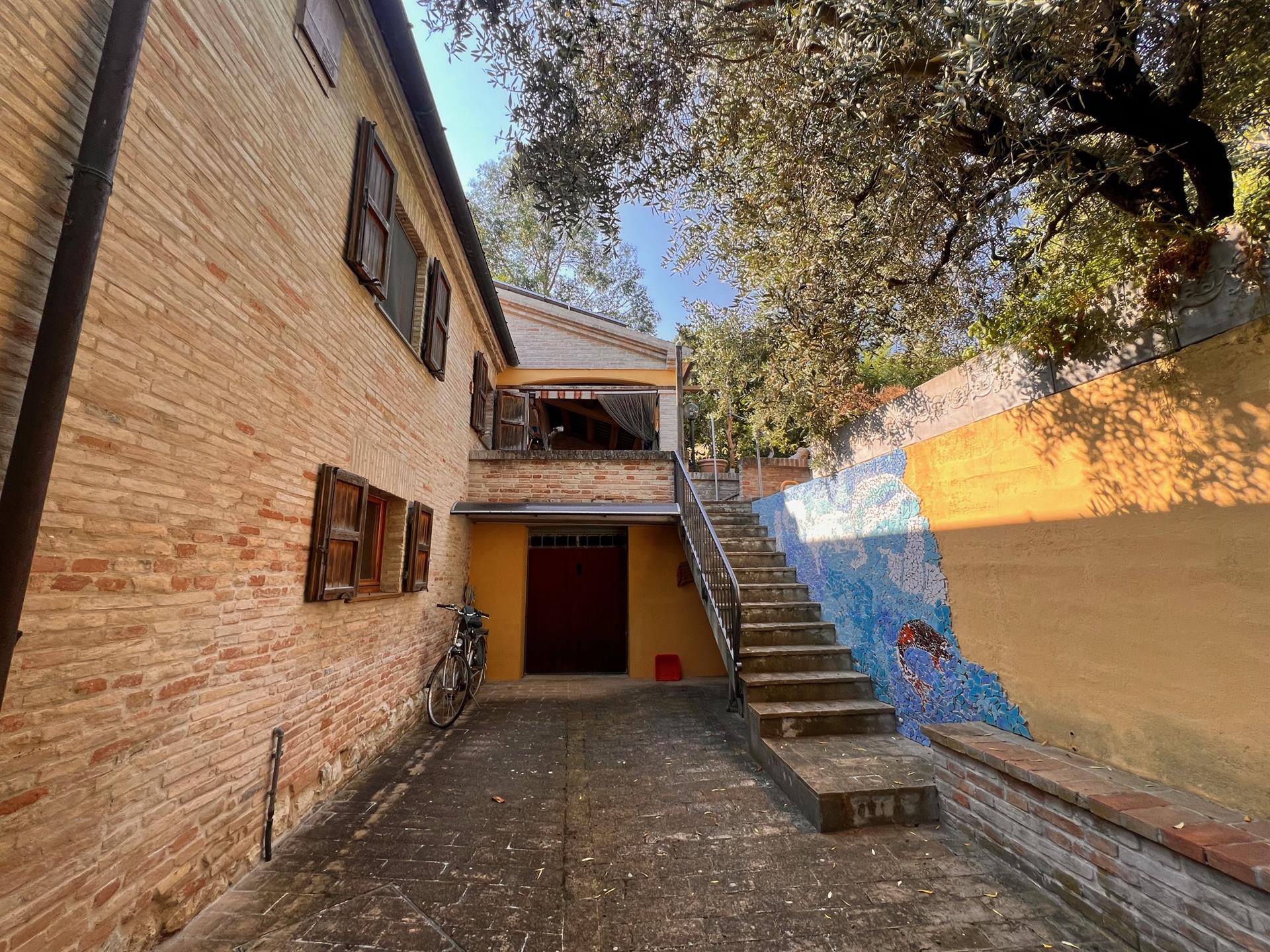 Cozy little brick house, view of Cartoceto