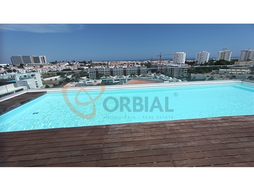 2 bedroom apartment with garage and rooftop pool for sale in Albufeira