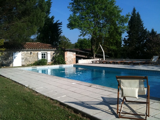 Stone property with outbuilding and swimming pool