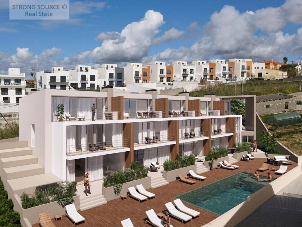 Condominium with 9 three-bedroom duplex apartments facing the sea and very close to the beaches, in