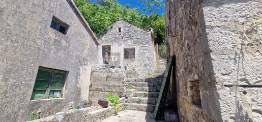 Traditional stone house surrounded by nature