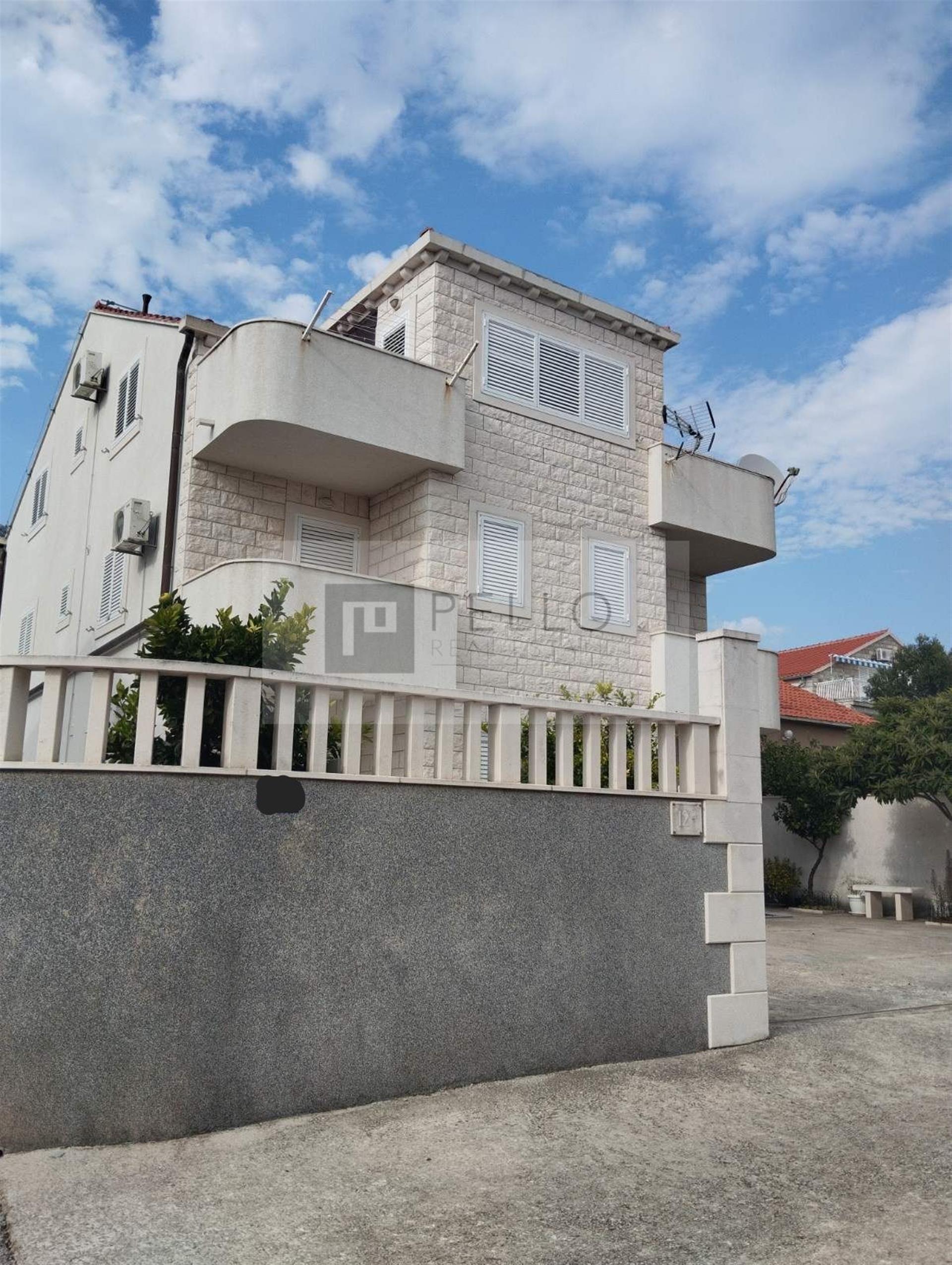 Apartment house with a stone facade