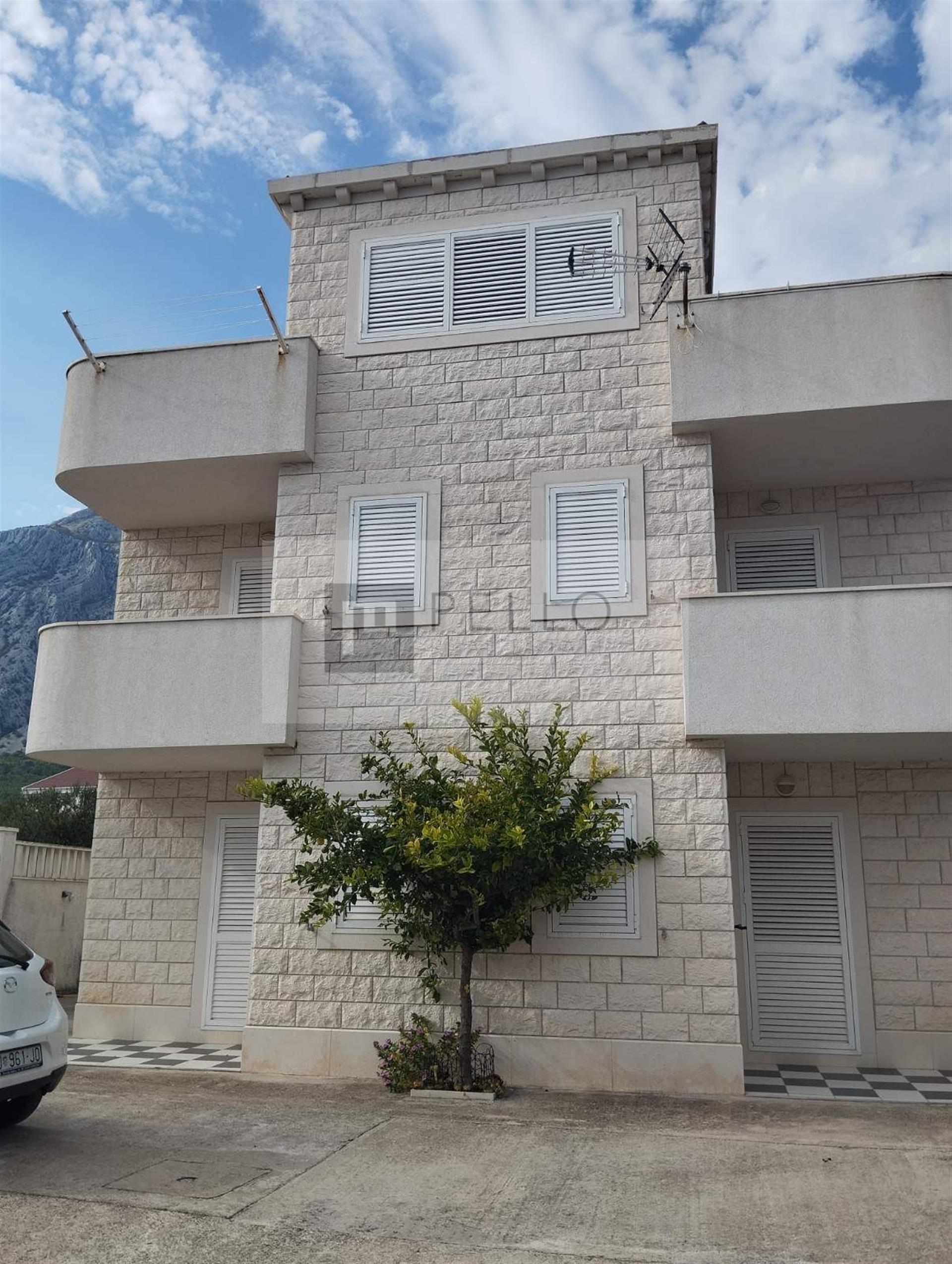Apartment house with a stone facade