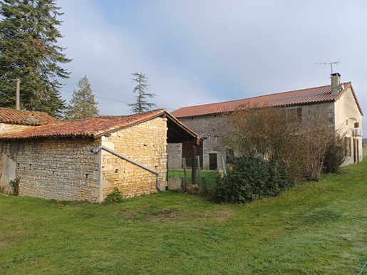 Renovated farmhouse with attached barn and small roofs
