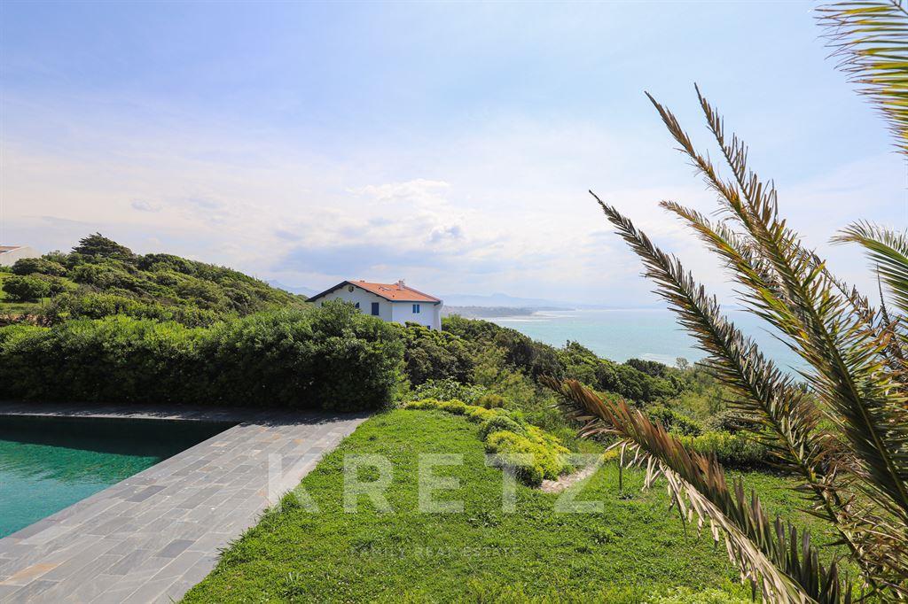 Property on the ocean with panoramic view.