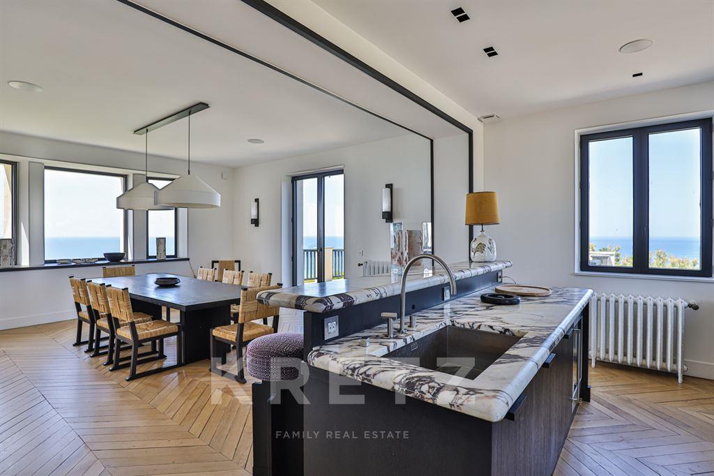 Property on the ocean with panoramic view.