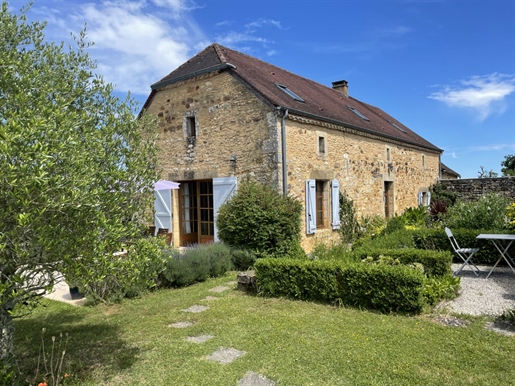 In the Périgord Noir region, between the Lot and Dordogne rivers, renovated stone barn with swimming