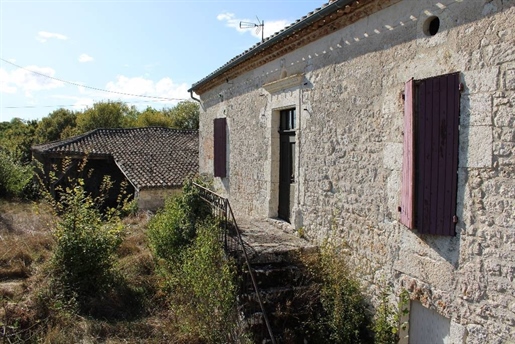 Stone house with outbuildings 15 km from Beauville