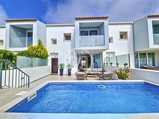 Beautiful townhouse with 4 bedrooms, two large private terraces and swimming pool and box garage.