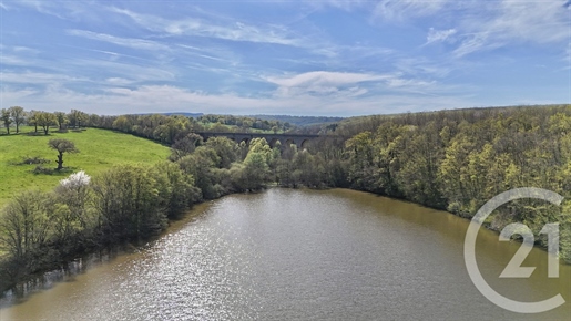 Tytuł: Wyjątkowa Nieruchomość z Stawem o Powierzchni 7,5 Hektara