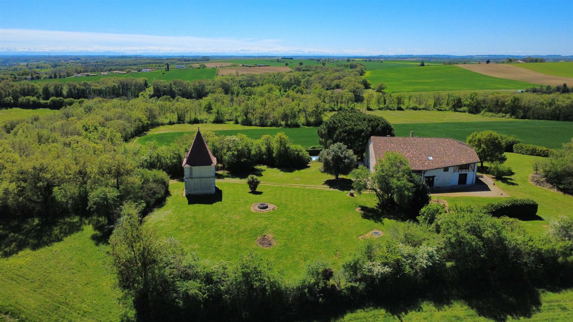 A timeless white stone estate with panoramic views