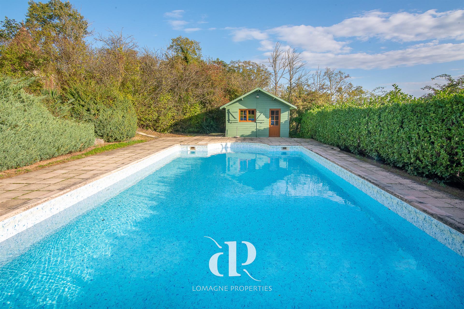 A timeless white stone estate with panoramic views