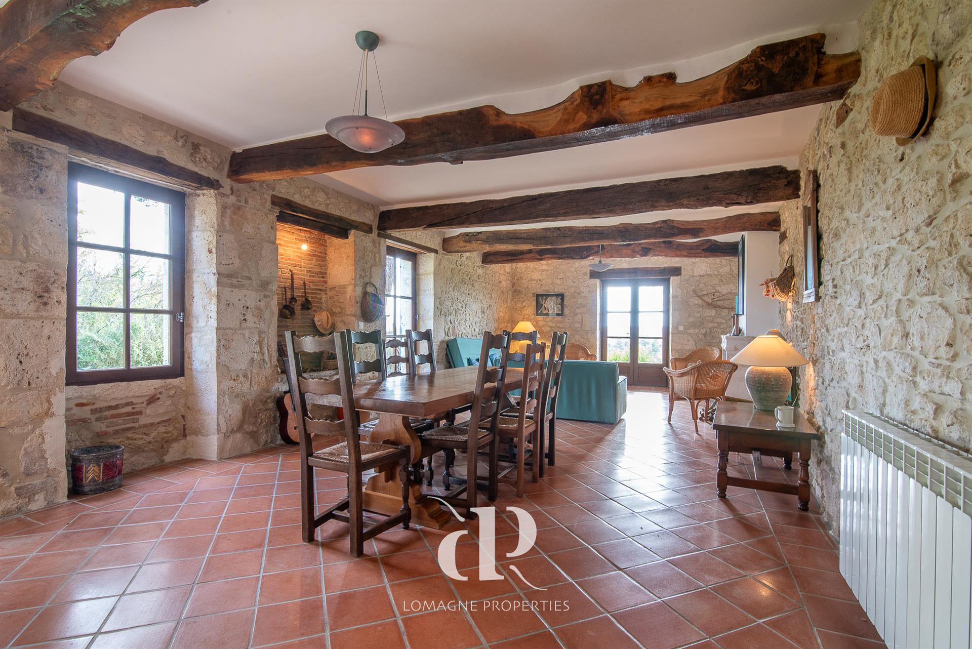 A timeless white stone estate with panoramic views