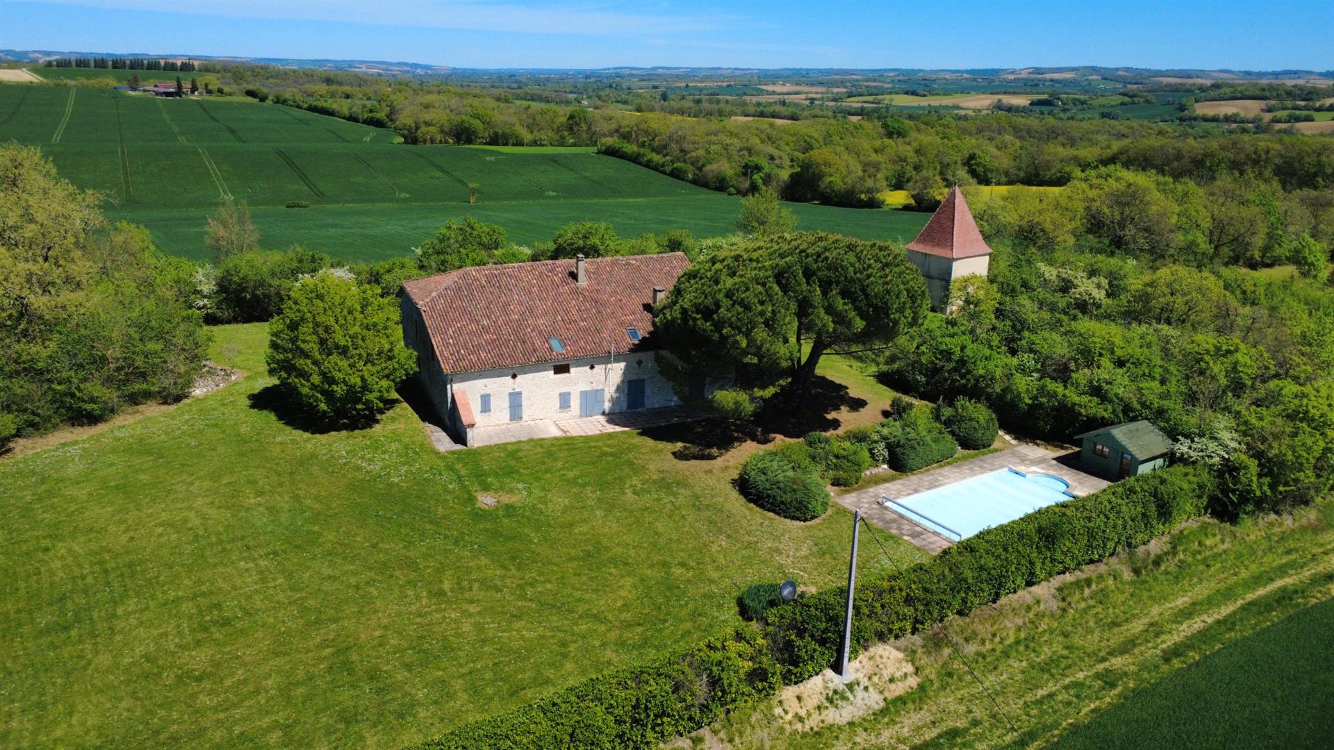 A timeless white stone estate with panoramic views
