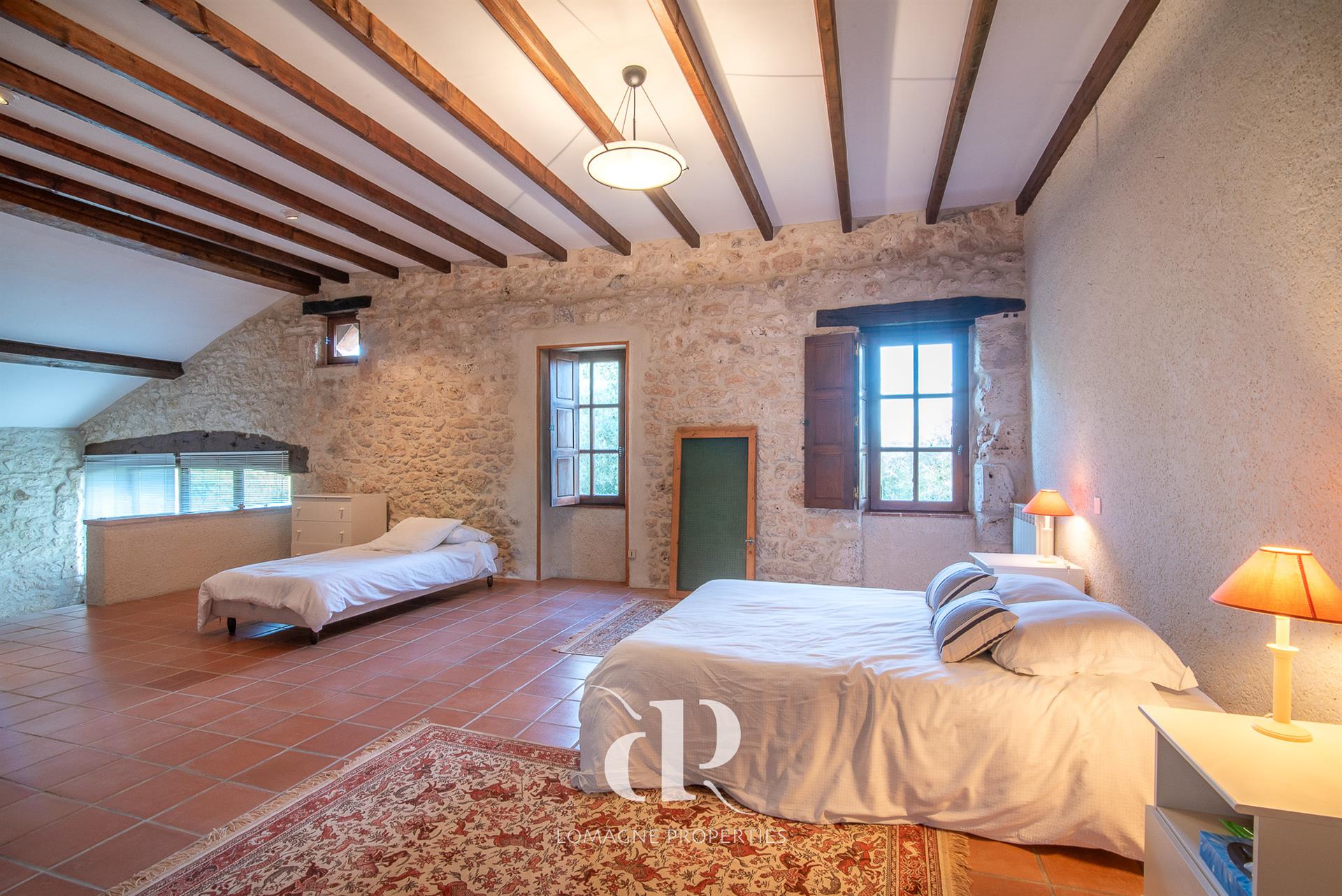 A timeless white stone estate with panoramic views