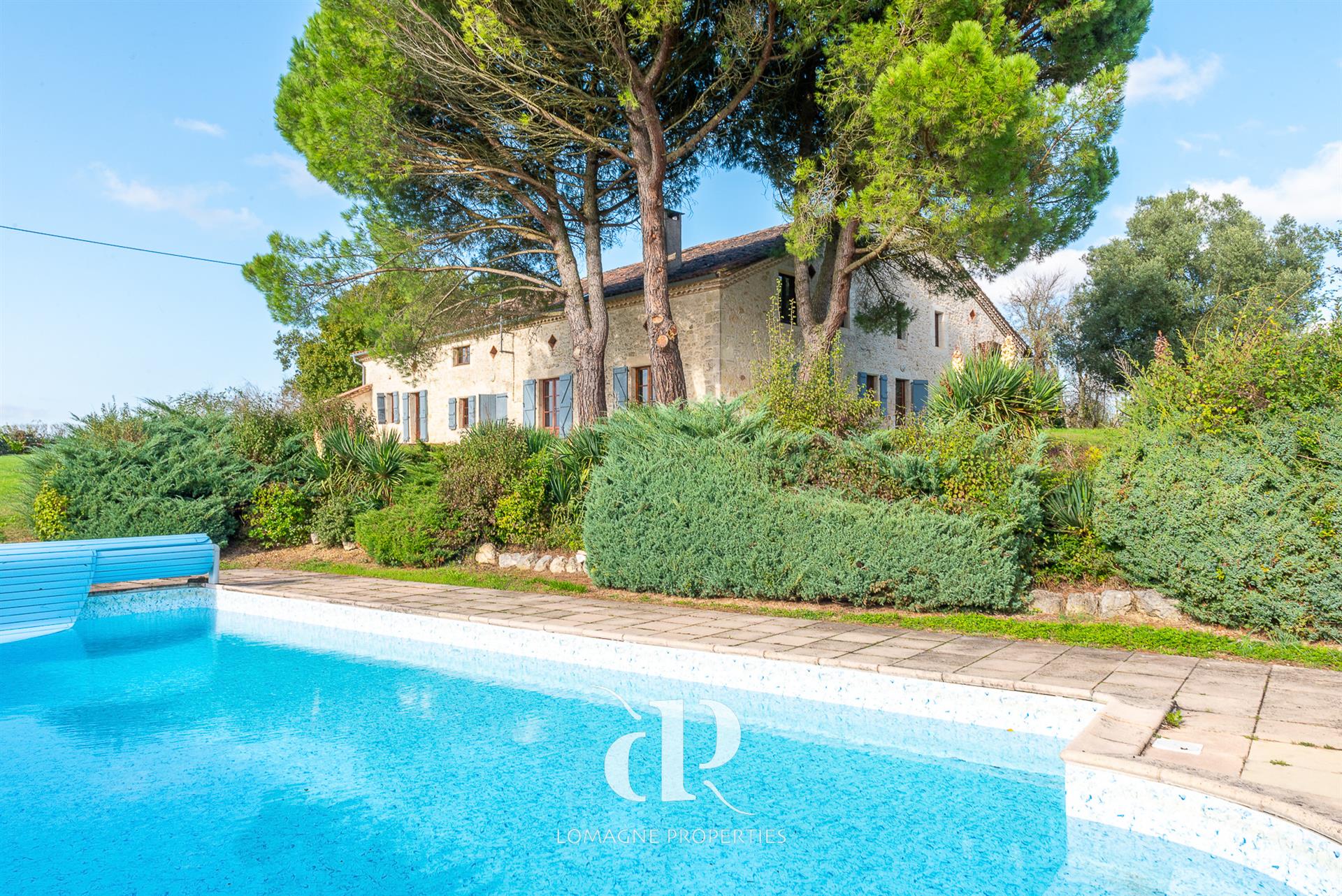 A timeless white stone estate with panoramic views