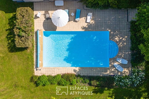 Historical property and its outbuildings with swimming pool.